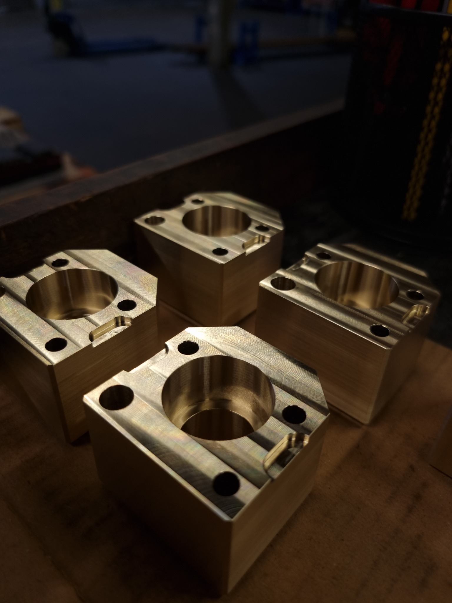 Machined metal components with circular bores and clean features